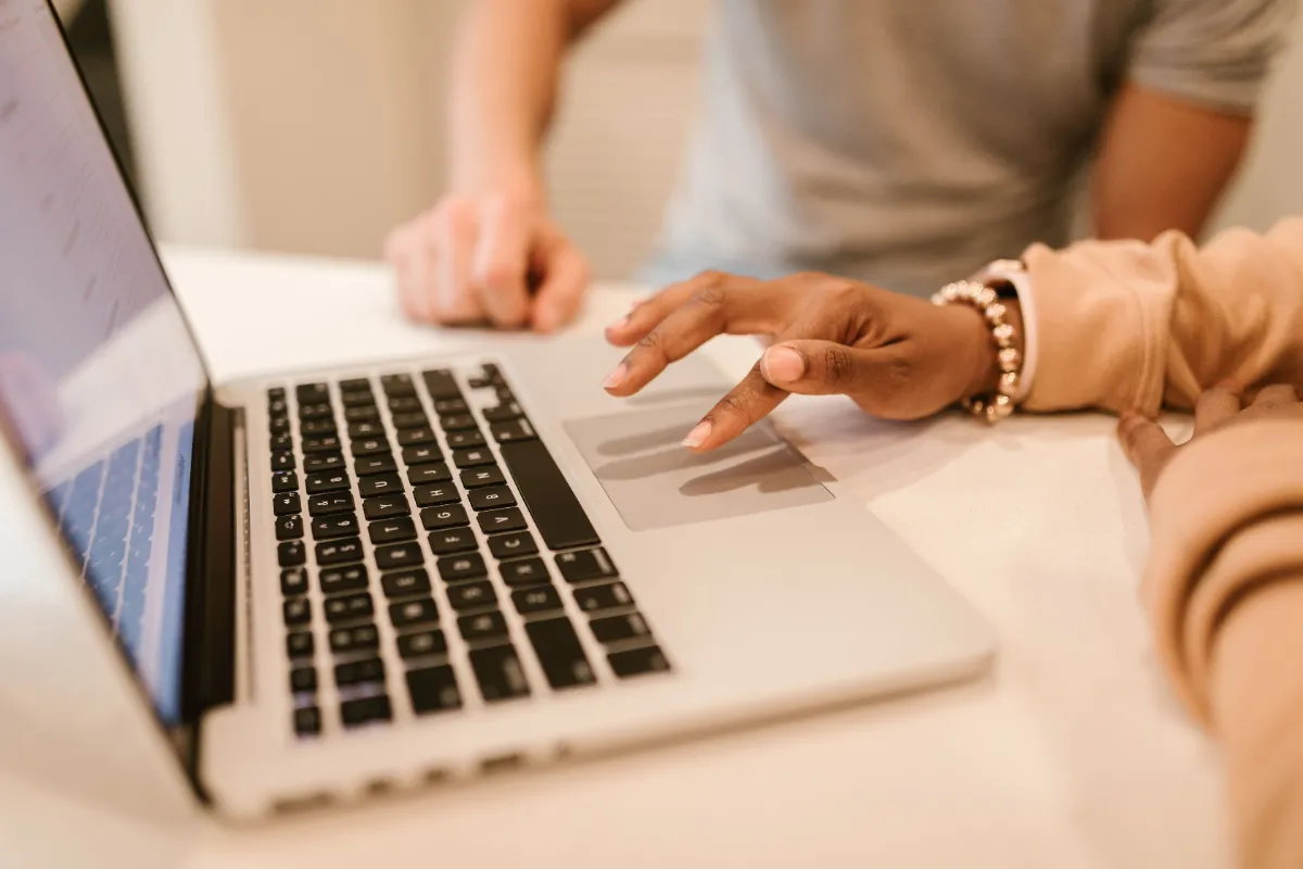 A person browsing the web on a laptop